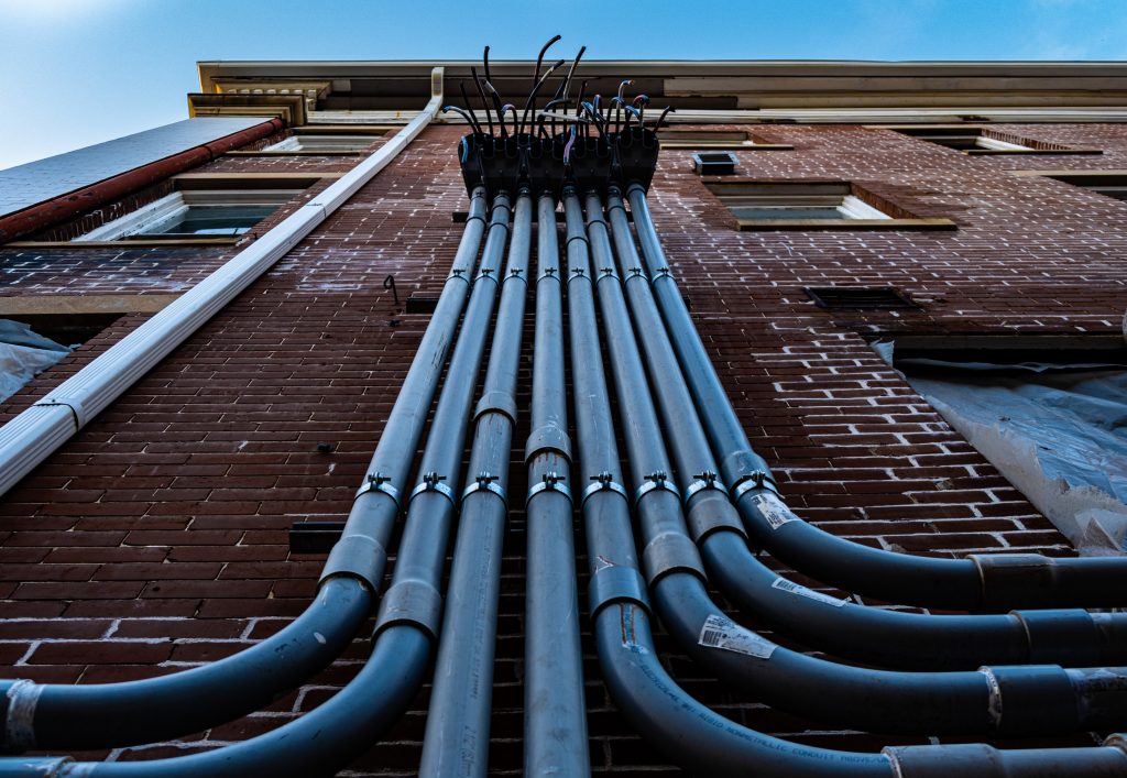 Pipes along a building wall Plumber Fremantle from Perth Plumbing and Gasfitting